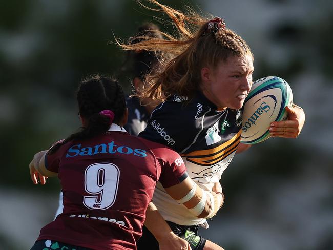 SYDNEY, AUSTRALIA - APRIL 30:  Grace Kemp of the Brumbies is tackled by Dianne Hiini of the Reds during the Super W Semifinal match between Queensland Reds and ACT Brumbies at Concord Oval, on April 30, 2023, in Sydney, Australia. (Photo by Mark Metcalfe/Getty Images)