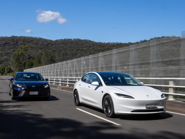 Tesla Model 3 and Toyota Camry Hybrid. Photo: Camber Collective