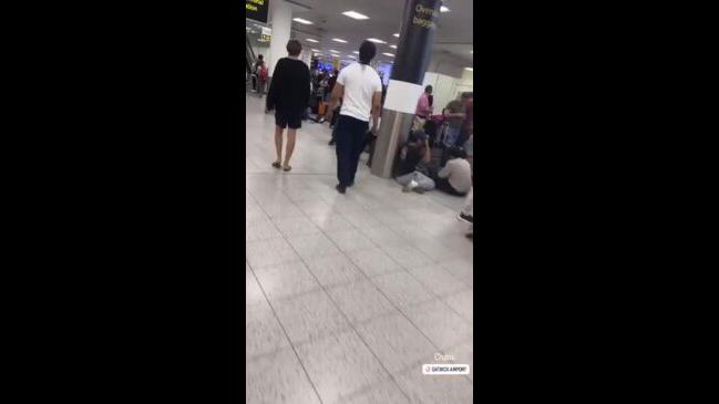 Waylaid Travelers Sit On Floor At Crowded Gatwick Airport Amid It Outage The Courier Mail 8733