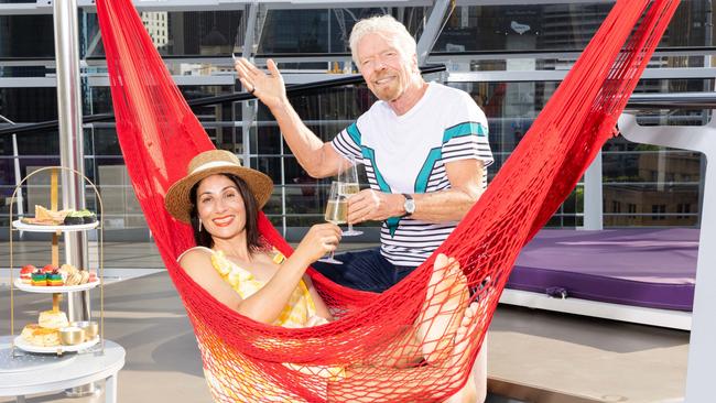 ***EMBARGOED UNTIL 12TH DECEMBER 2023***, Sir Richard Branson, chairman of the Virgin Group with school teacher Nicole Katrib on board a Virgin Voyages ship Resilient Lady. Photographer: Scott Elher