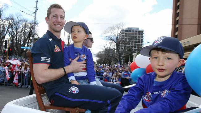 Dale Morris with his sons at the Grand Final parade. Picture: Michael Klein