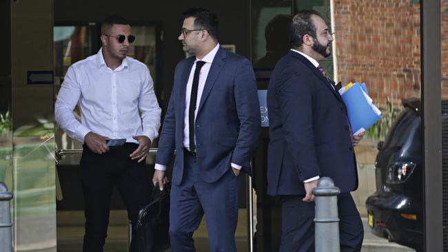 Matthew Ibrahim (left) leaves Parramatta Local Court with his lawyers. Picture: Adam Yip