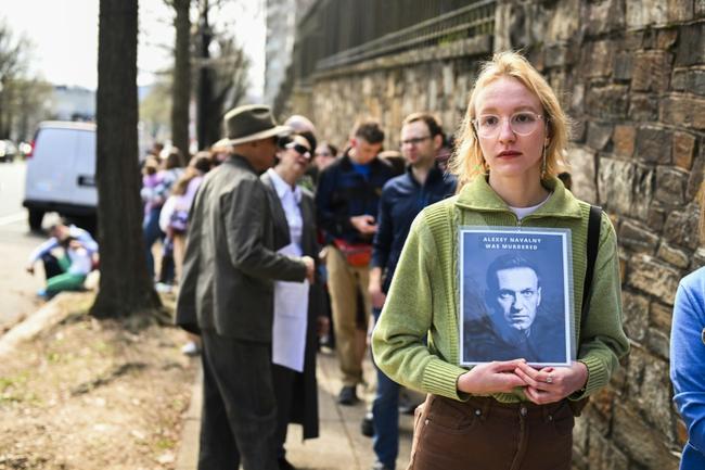 Hundreds of people queued outside the Russian embassy in Washington