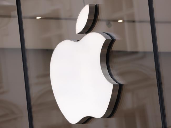 BERLIN, GERMANY - MARCH 25: The Apple logo hangs on an Apple Store on March 25, 2024 in Berlin, Germany. The European Commission is launching an investigation into Apple, Meta (the parent company of Facebook) and Alphabet (the parent company of Google) over whether the companies violate the new EU Digital Markets Act. (Photo by Sean Gallup/Getty Images)