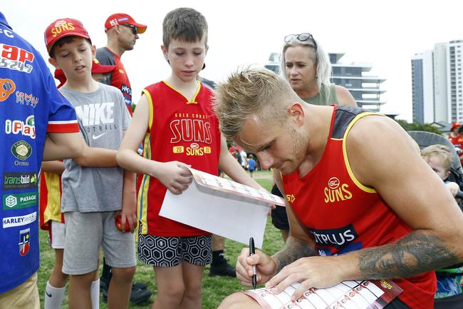 Gold Coast Suns player Brandon Ellis with fans at Palm Beach. Picture: Tertius Pickard