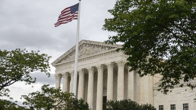 The US flag flying over the Supreme Court yesterday. Picture: Drew Angerer/Getty Images/AFP