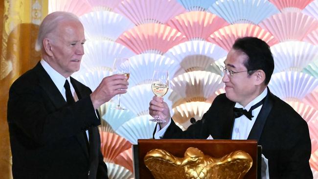 Joe Biden and Fumio Kishida raise their glasses at the state dinner in the East Room of the White House on Wednesday. Picture: AFP