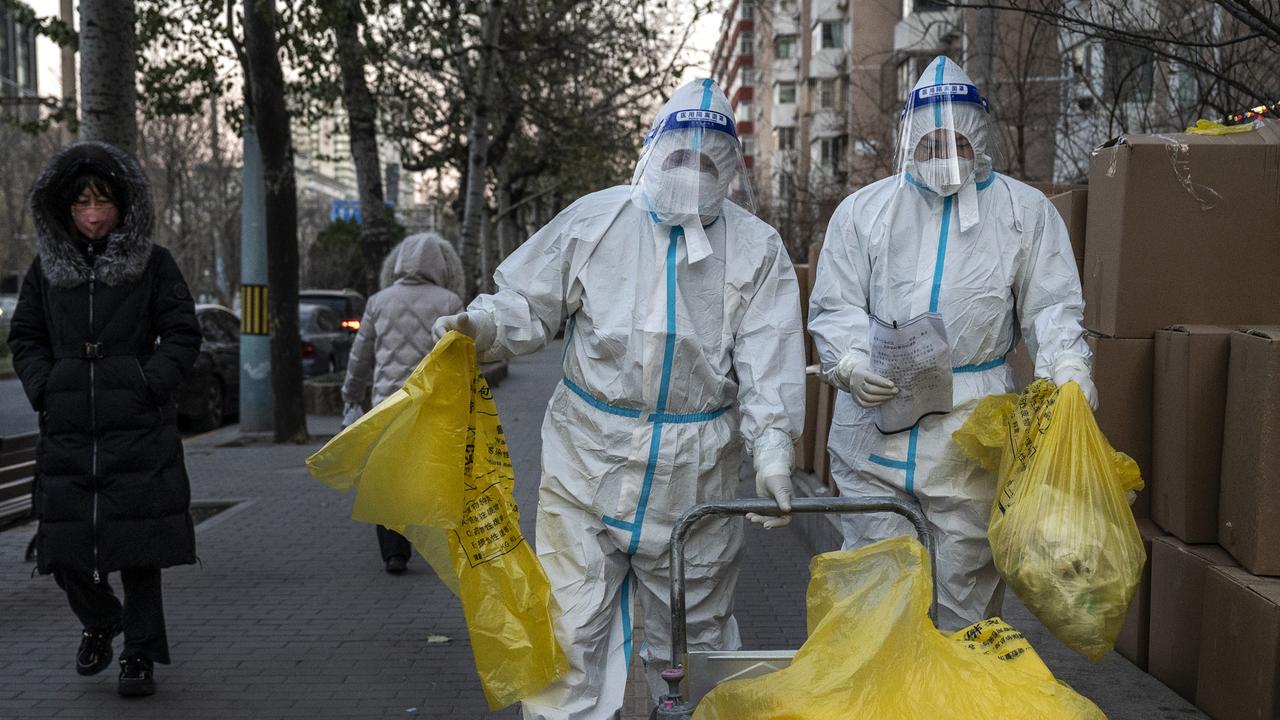 Epidemic control workers wear PPE. Picture: Kevin Frayer/Getty Images