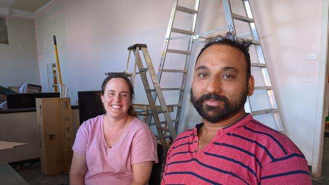 Satnam Singh Rath and his wife Erin Werner in their flooded store Masala Indian Fusion.