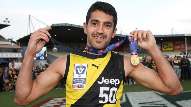 Marlion Pickett with his premiership and Norm Goss medals. Picture: Michael Klein