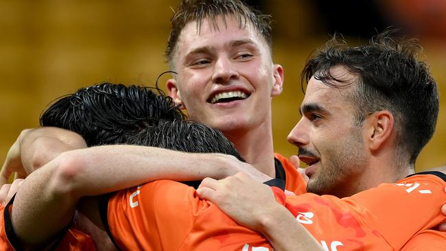 BRISBANE, AUSTRALIA - FEBRUARY 10: Thomas Waddingham of the Roar celebrates with team mates after scoring a goal during the A-League Men round 16 match between Brisbane Roar and Melbourne City at Suncorp Stadium, on February 10, 2024, in Brisbane, Australia. (Photo by Bradley Kanaris/Getty Images)