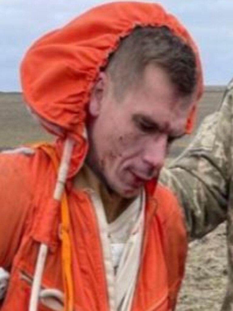 A captured Russian pilot is taken into custody. Picture: Supplied