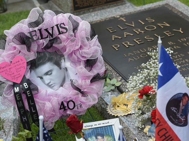 Gravesite tributes left by fans in the Meditation Garden where Elvis Presley is buried alongside his parents and grandmother at his Graceland mansion. Picture: AFP