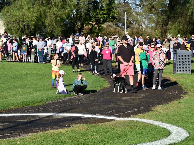 Mourners honour the memory of Molly Ticehurst by walking together around Lake Forbes. Picture: Dane Millerd