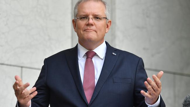 Prime Minister Scott Morrison says wage subsidies are coming, as he appeals to businesses to hold off standing down workers. Picture: AAP