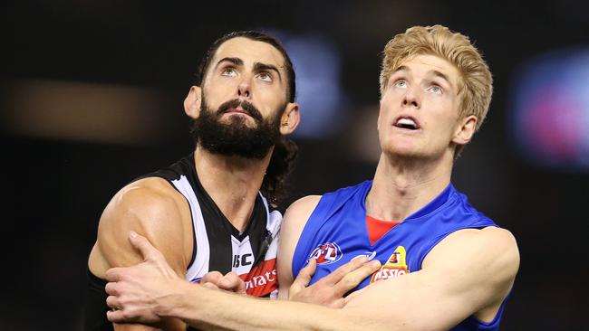 Tim English bodies with Brodie Grundy in a ruck contest last season. Picture: Michael Klein.