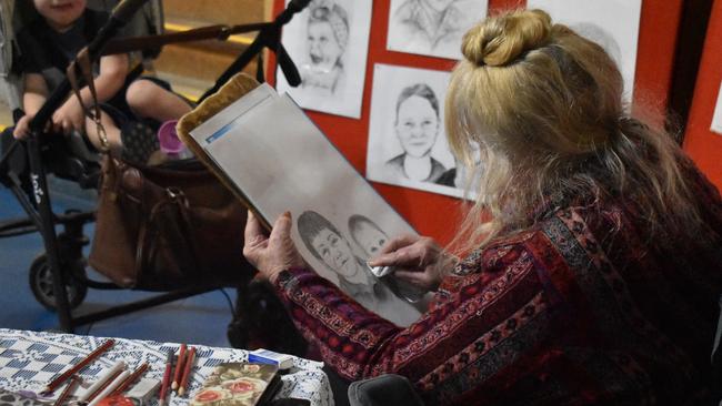 Rozanna Donovan working on pencil portraits at the Gatton Show on Friday, July 21. Picture: Peta McEachern