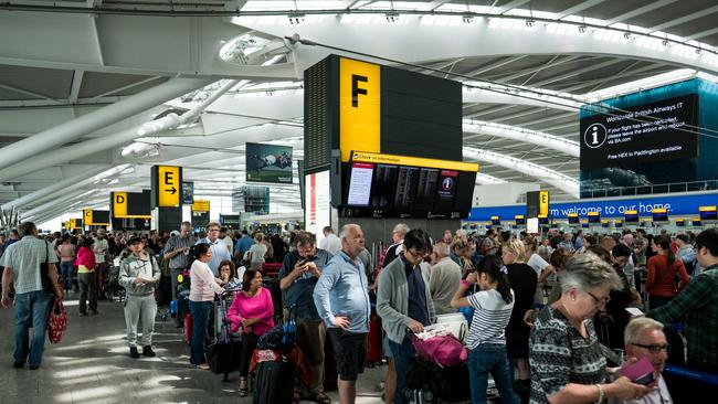 People queue for check-in at Heathrow Airport. Picture: Getty