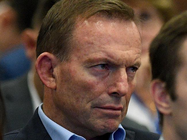 Former prime minister Tony Abbott watches on as Prime Minister Malcolm Turnbull delivers an address at the 59th Liberal Party Federal Council Meeting in Sydney, Saturday, June 24, 2017. (AAP Image/Dan Himbrechts) NO ARCHIVING