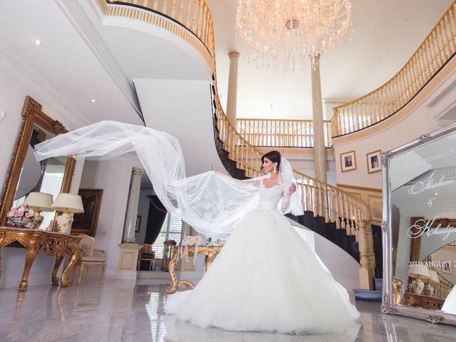 Kat Mehajer donning her designer wedding dress, one of many, at the Kenthurst mansion where some of the celebrations occurred. Picture: supplied.