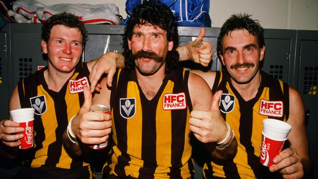 Hawks Gary Buckenara, Robert DiPierdomenico and John Kennedy celebrate after winning the 1989 VFL Grand Final against Geelong.