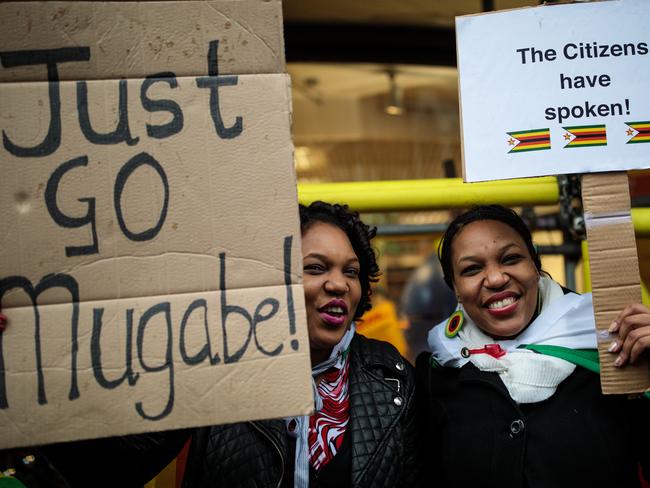 Protesters demonstrate outside the Embassy of Zimbabwe in London to call on the leader of the country Robert Mugabe to resign. Picture: Jack Taylor/Getty Images