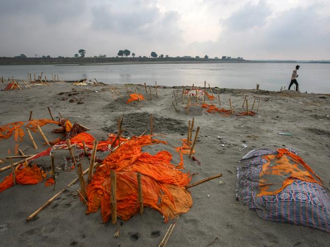 Bodies, some of which are believed to be COVID-19 victims, are partially exposed at a cremation ground on the banks of the Ganges River in Shringverpur, northwest of Allahabad. Picture: Getty Images