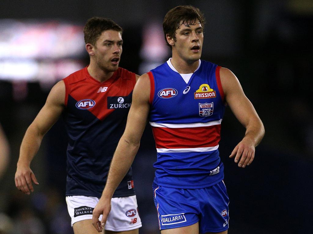 Josh Dunkley of the Bulldogs (right) led all comers in SuperCoach in Round 17 — including his brother Kyle Dunkley of the Demons