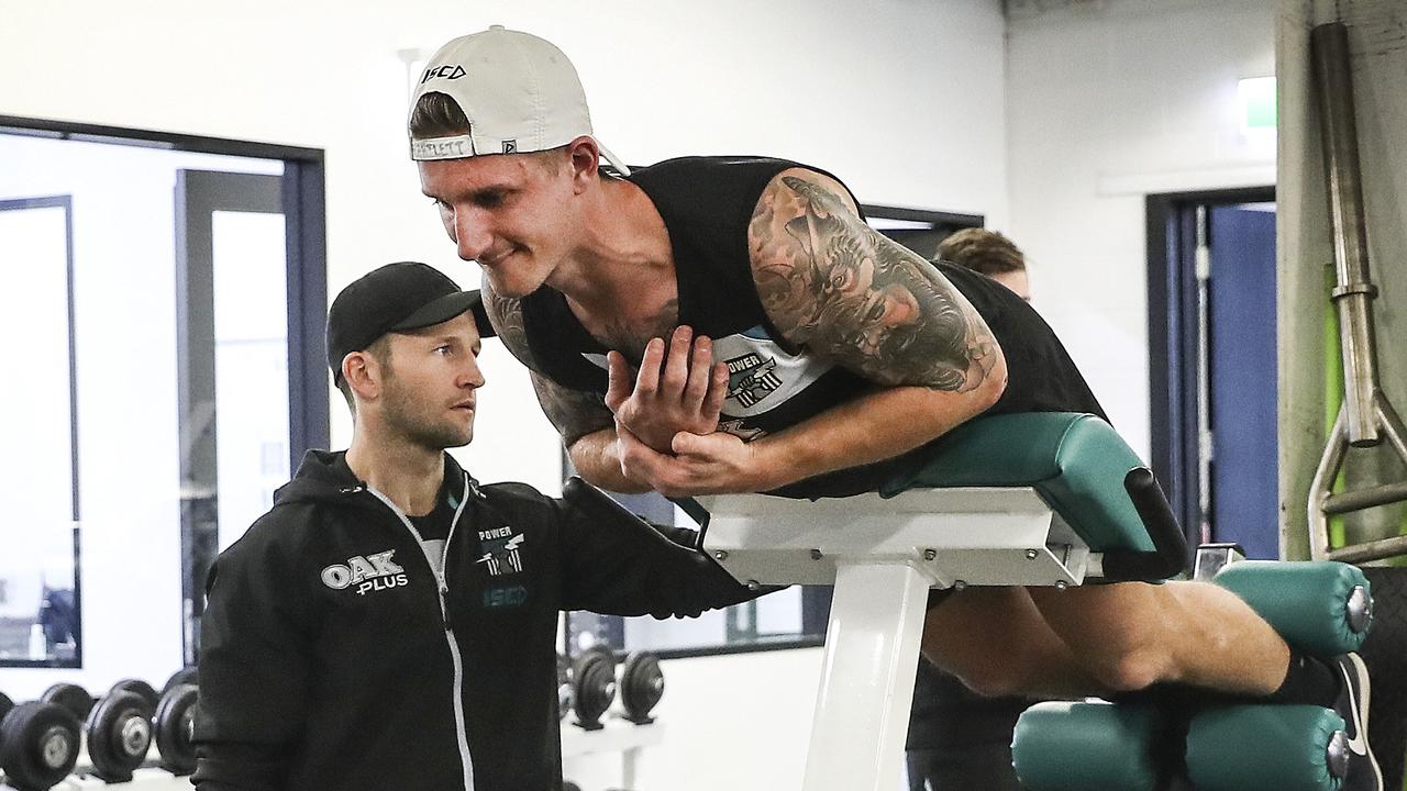 Hartlett working out in the gym as he recovers from ACL surgery last July, 10 weeks after his injury. Picture SARAH REED