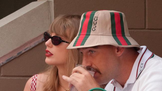 US musician Taylor Swift and US NFL football player Travis Kelce attend the men's final match between Italy's Jannik Sinner and USA's Taylor Fritz on day fourteen of the US Open tennis tournament at the USTA Billie Jean King National Tennis Center in New York City, on September 8, 2024. (Photo by TIMOTHY A. CLARY / AFP)