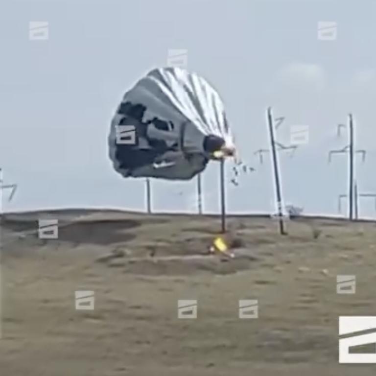 The moment the hot air balloon hit the powerlines as it tried to land and started to tear apart. Picture: East 2 West