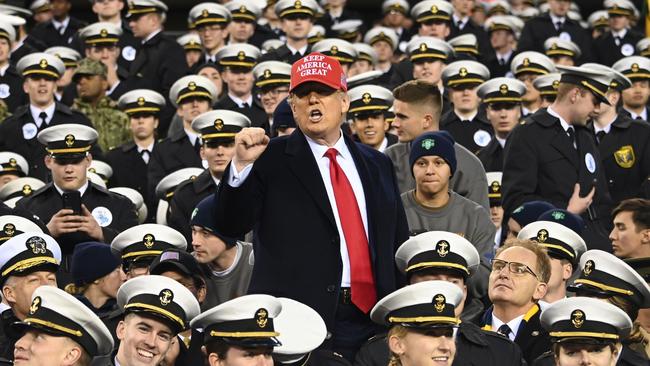 US President Donald Trump joins Naval Academy cadets during the the Army v. Navy American Football game in Philadelphia on Saturday. Picture: AFP