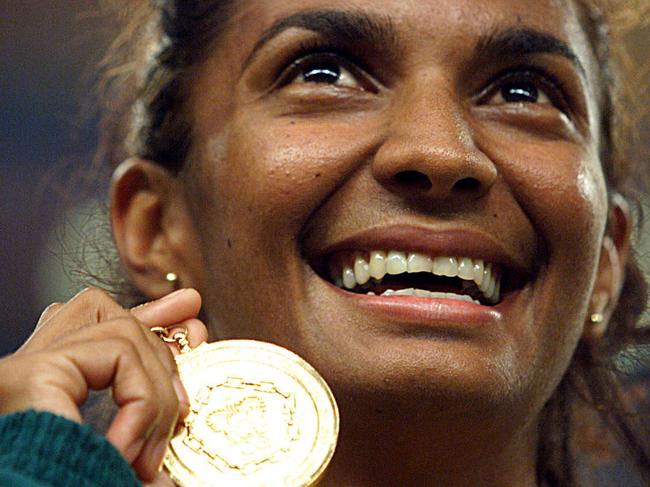 DIGITAL IMAGE Athlete Nova Peris-Kneebone displays gold medal won in women's 200 final of 1998 Commonwealth Games in Kualal Lumpur 19/09/98.Athletics P/