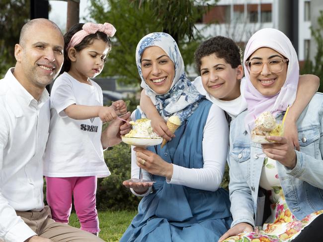 Huda Al Sultan, centre, enjoying her home-made Sassi ice cream with husband Adam, daughters Sidra and Renad, and son Mohammed. Photo: AAP/Emma Brasier