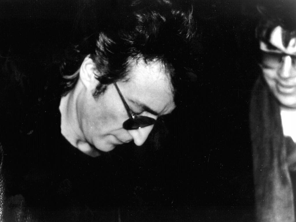 John Lennon signing an autograph for his killer Mark David Chapman outside his apartment hours before his death. Picture: Paul Goresh.