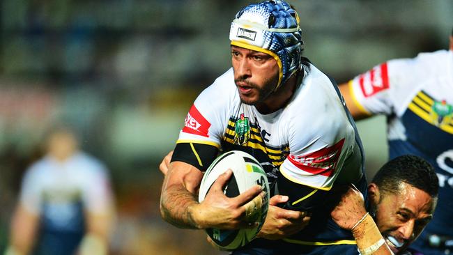 The North Queensland Cowboys v Melbourne Storm from 1300 Smiles Stadium. Cowboys Jonathan Thurston is tackled by Storm's Ben Roberts. Picture: Zak Simmonds