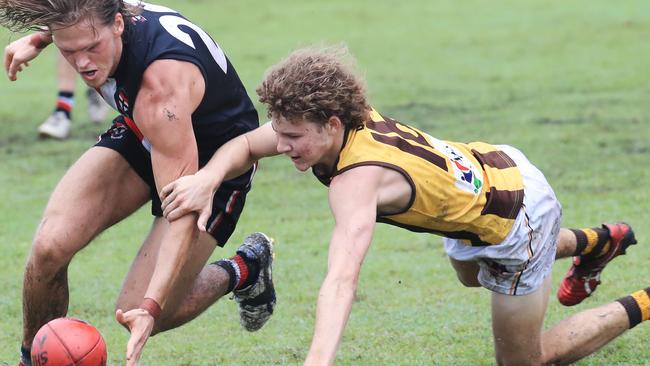 Saints' Dylan McConachy and Hawks' Josh Welsford battle for the loose ball in the AFL Cairns match between the Cairns Saints and the Manunda Hawks, held at Griffiths Park, Manunda. Picture: Brendan Radke