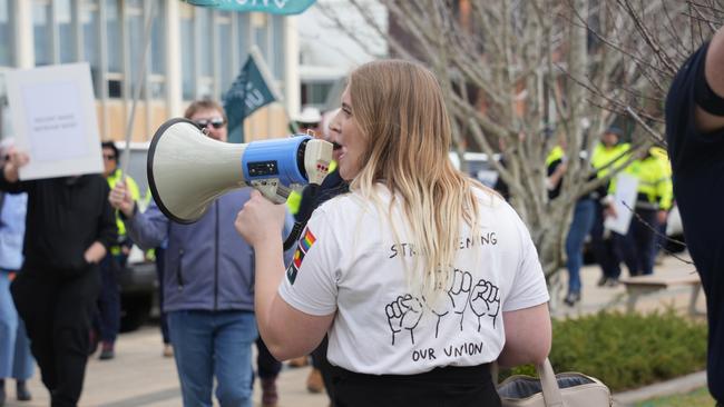 The Services Union members and Toowoomba Regional Council employees take part in strike action outside City Hall, July 25 2024. TSU organiser Anna Krupitza leads a march.