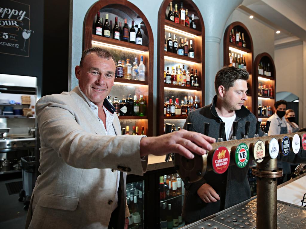 SYDNEY, AUSTRALIA- News Wire photos October 11 2021- Owners of Watson's pub in Moore (LR) Danny Stapleton and Michael Watson pouring one of their first beers for a customer on NSW Freedom day. Picture: NCA NewsWire / Adam Yip