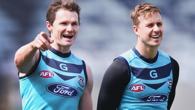 Patrick Dangerfield and Mitch Duncan share a laugh together at training.