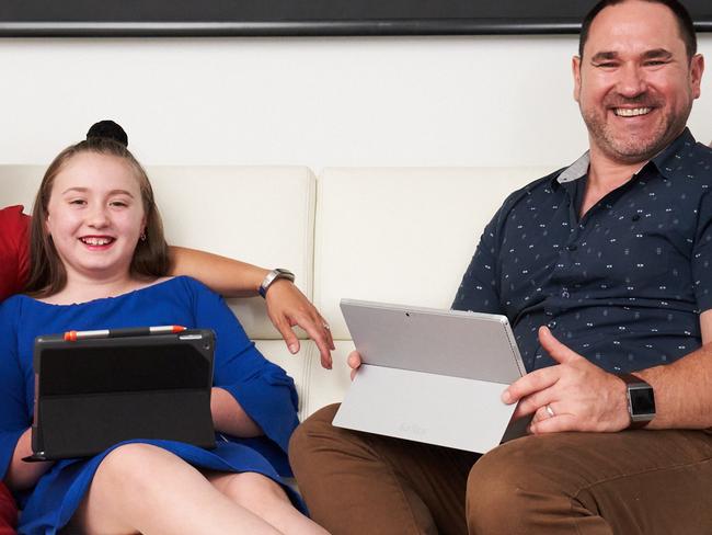 Karyn and Nick Route pose for a picture with their kids Angelique, 9 and Ethan, 8 at home in Pasadena, with their many connected devices to the NBN, Friday, Jan. 31, 2020. Picture: MATT LOXTON