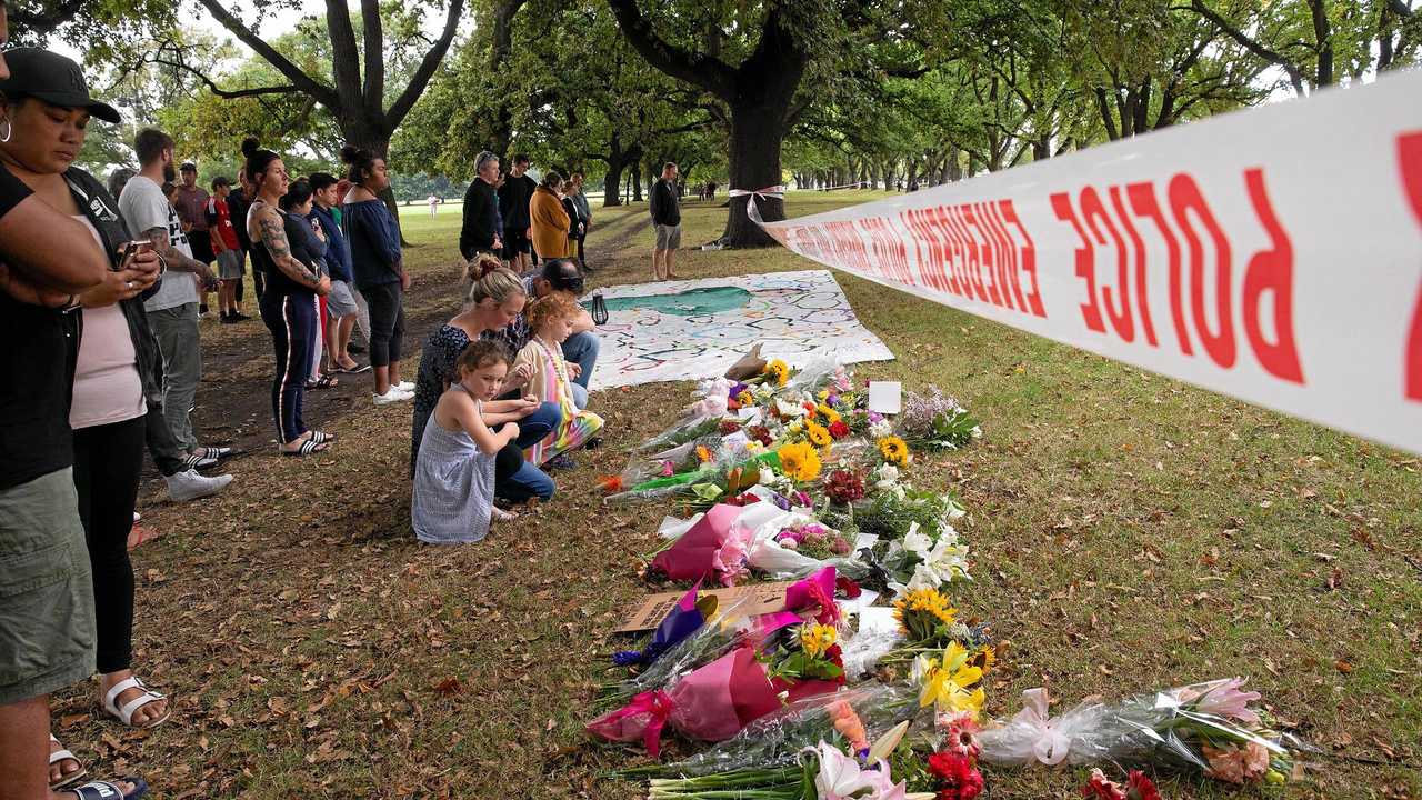 Flowers and messages of respect are placed in Hagley Park across from the mass shooting scene at the Masjid Al Noor, Christchurch, New Zealand. Picture: MARTIN HUNTER