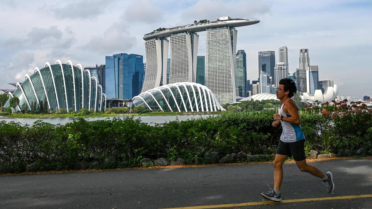 A man jogs along Marina Bay East Park near the financial business district in Singapore on October 20, 2021. Picture: Roslan Rahman/AFP