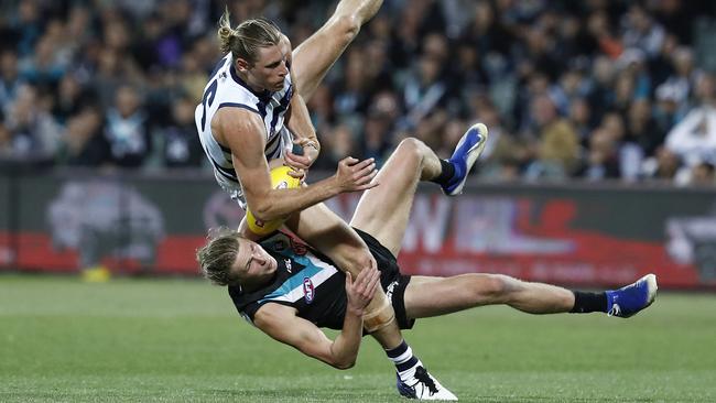 Port young gun Xavier Duursma came off second best in a marking contest with Cat Mark Blicavs. Picture: Getty Images