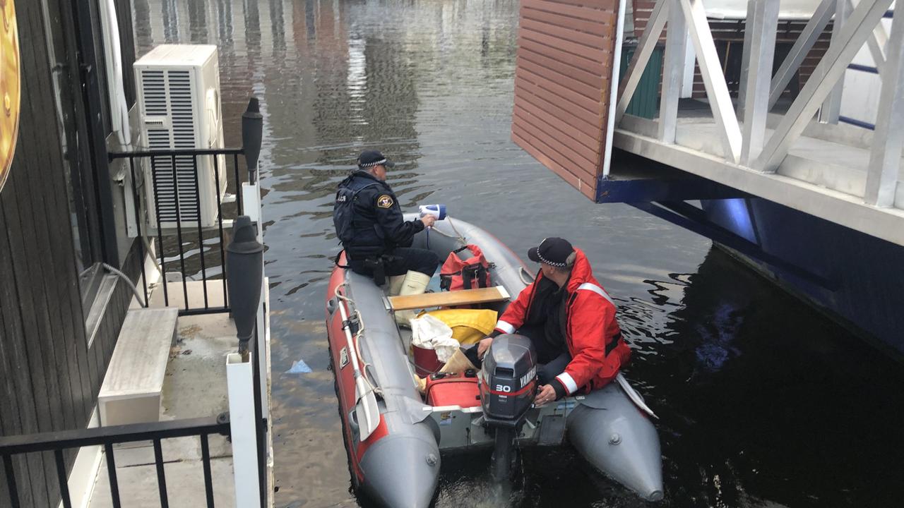 Police search the Hobart waterfront for a man who escaped police custody at the Hobart magistrates court. Photo: Nikki Davis-Jones