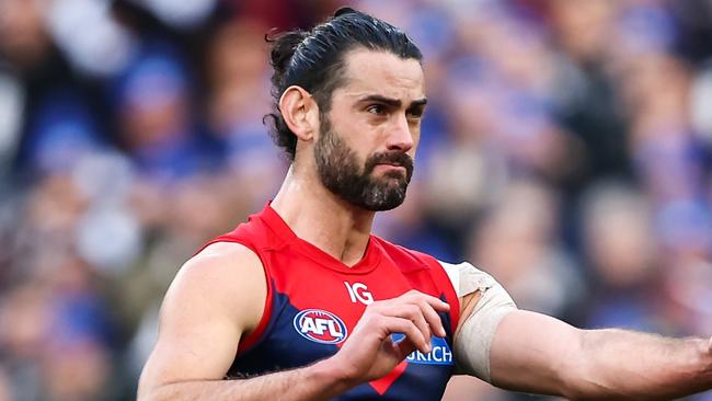 MELBOURNE, AUSTRALIA - JUNE 12: Brodie Grundy of the Demons kicks the ball during the 2023 AFL Round 13 match between the Melbourne Demons and the Collingwood Magpies at the Melbourne Cricket Ground on June 12, 2023 in Melbourne, Australia. (Photo by Dylan Burns/AFL Photos via Getty Images)