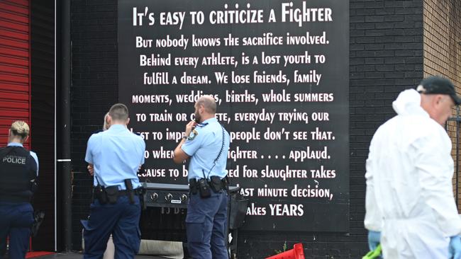 Police investigators at the scene at Elite Fight Force gym in Sefton on Friday. Picture: Jeremy Piper