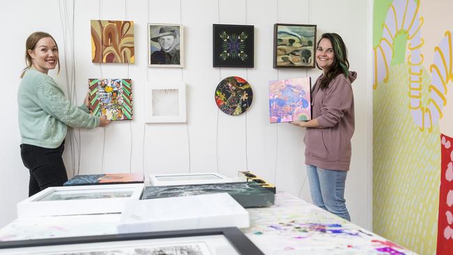 Elysha Rei (left) and Alex Stalling prepare for the Made. Reunion Show featuring 20 artists who exhibited with Made Creative Space between 2011 and 2013. Picture: Kevin Farmer