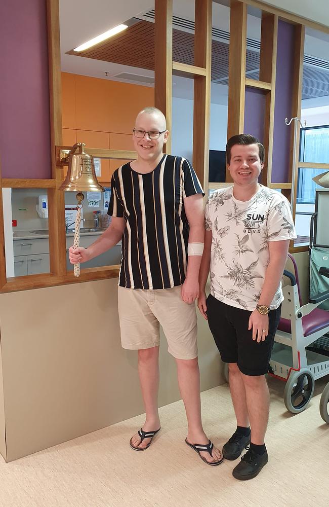 Jacob McLucas and Aden Stokes ringing the bell to signify Jacob is in remission.