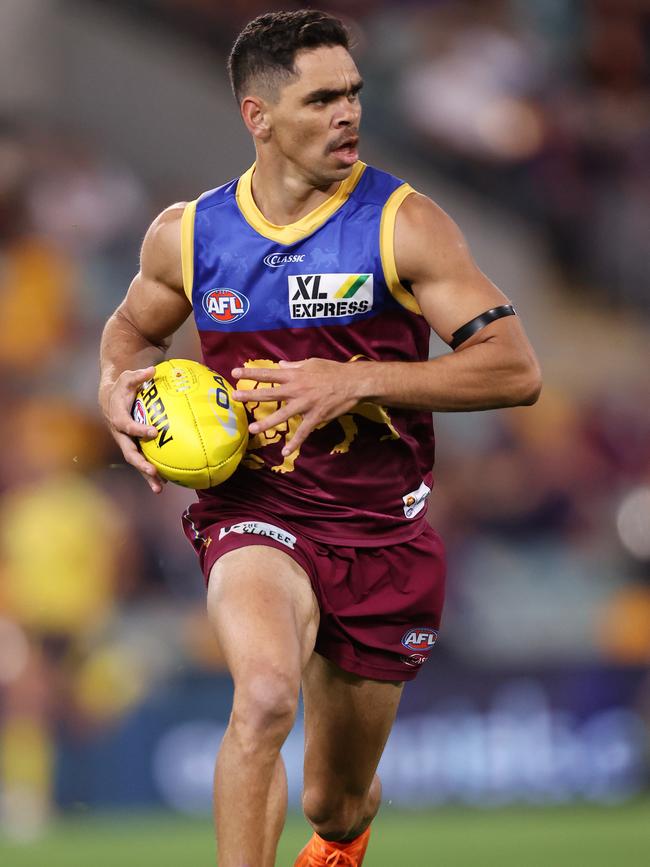 Charlie Cameron of the Lions charges down the wing.